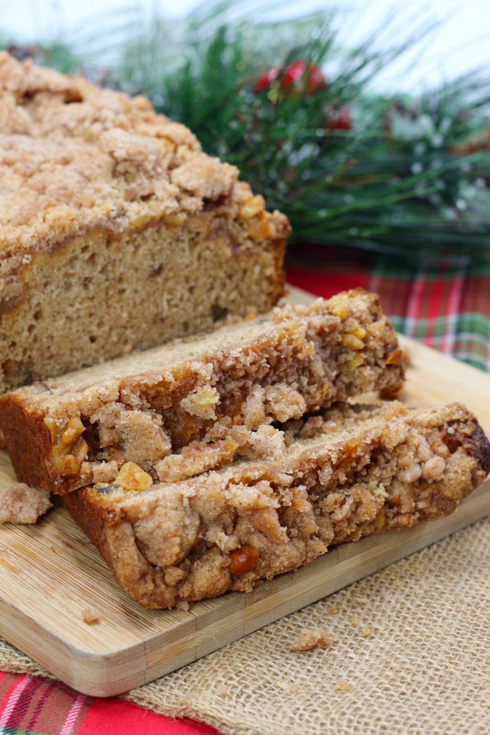 a close up of a few slices of coffee cake banana bread and its loaf