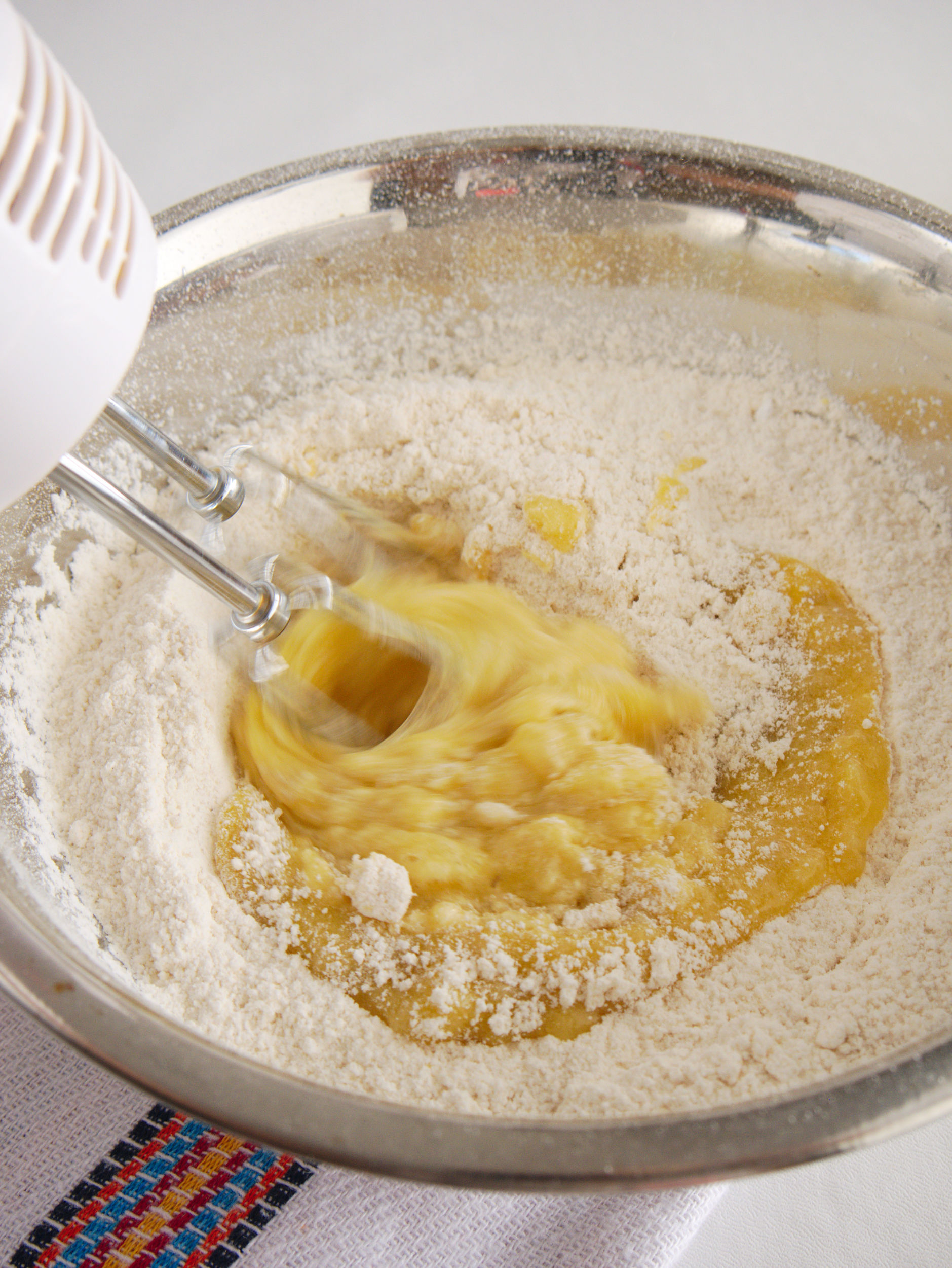a hand mixer is used to combine the wet ingredients and dry ingredients