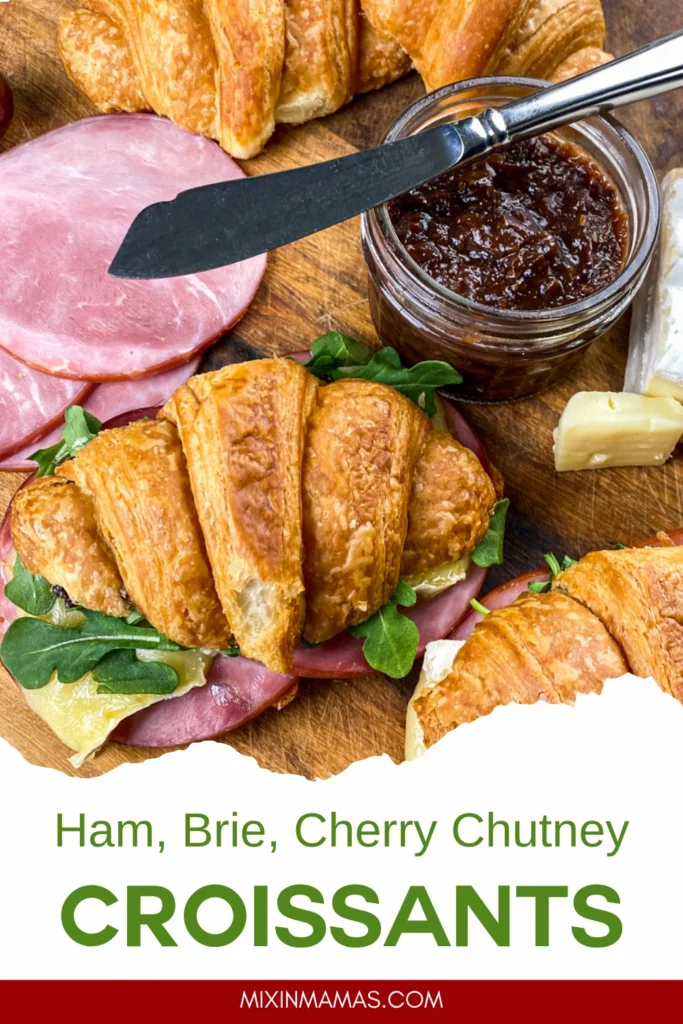 Pinterest graphic featuring ham, Brie, cherry chutney croissant sandwiches with a rustic serving board and fresh ingredients.
