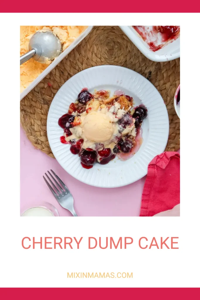 Overhead shot of cherry dump cake served with vanilla ice cream, surrounded by baking dish and ice cream tub