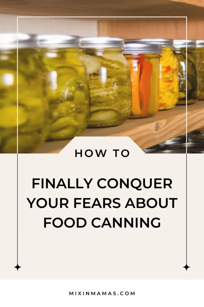Row of homemade pickles and vegetables stored in canning jars on a wooden shelf.