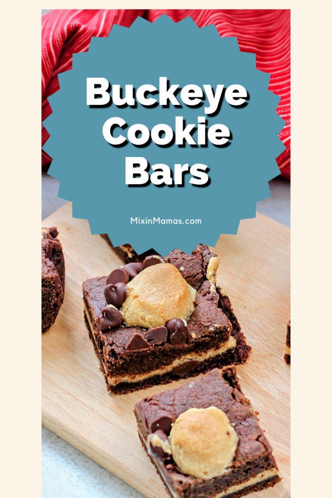Buckeye Cookie Bars arranged on a wooden board, framed with a red textured cloth in the background.