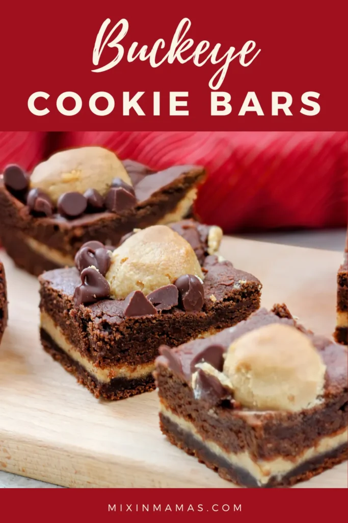 Close-up of Buckeye Cookie Bars displayed on a wooden board, showing the layers of chocolate cookie and peanut butter with chocolate chips on top.