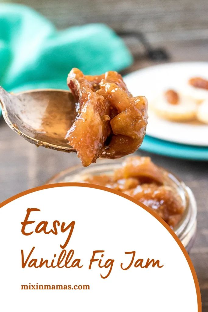 Close-up of spoonful of vanilla fig jam over a jar, with a teal napkin in the background and text that reads “Easy Vanilla Fig Jam – mixinmamas.com.