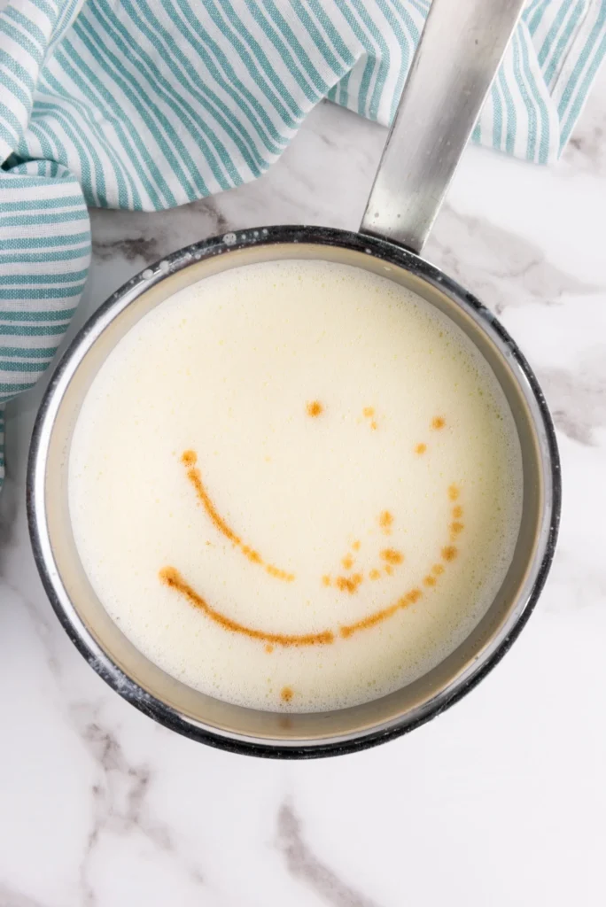 Cooked homemade eggnog in a saucepan ready to cool