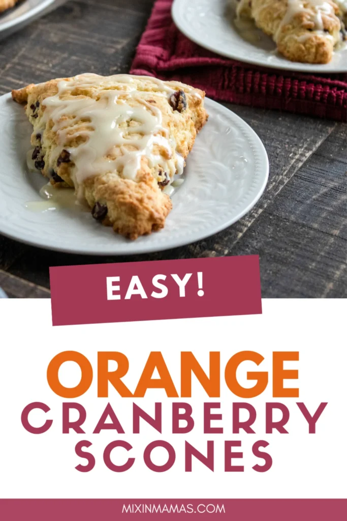 Easy orange cranberry scones with orange glaze on a white plate