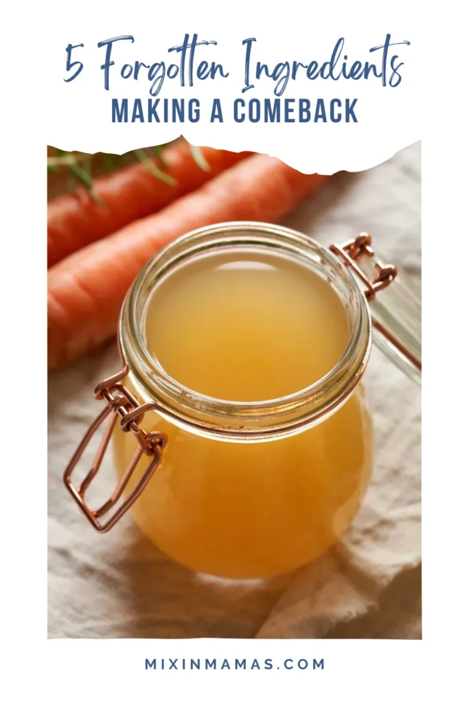 Glass jar of homemade vegetable broth with carrots in the background and text reading “5 Forgotten Ingredients Making a Comeback”
