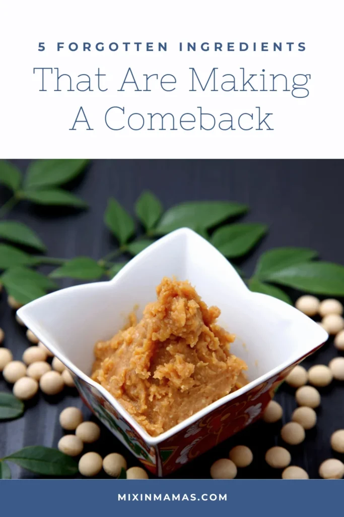 White miso paste in a decorative bowl surrounded by soybeans with text reading “5 Forgotten Ingredients Making a Comeback”