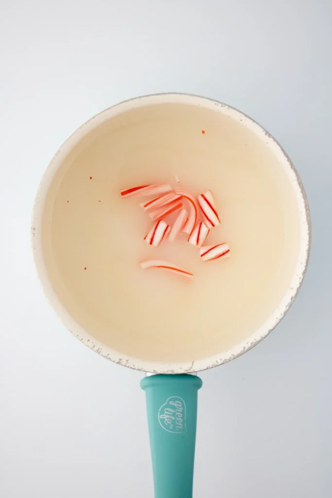 Peppermint marshmallow sugar syrup boiling in a saucepan