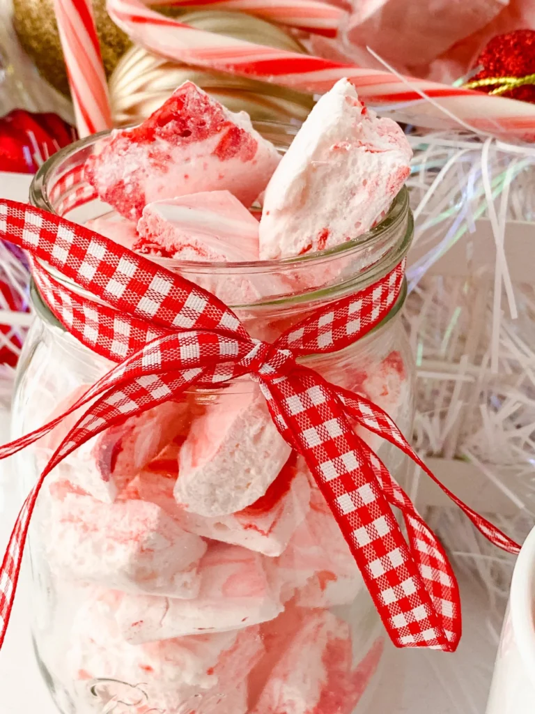 Homemade peppermint marshmallows packaged in a gift jar with ribbon
