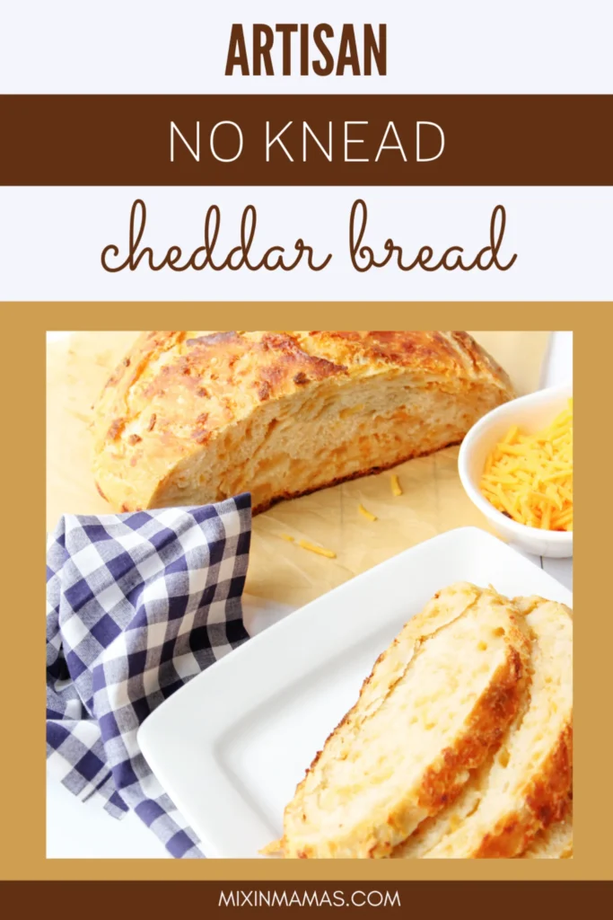 Artisan no-knead cheddar bread sliced and ready to serve