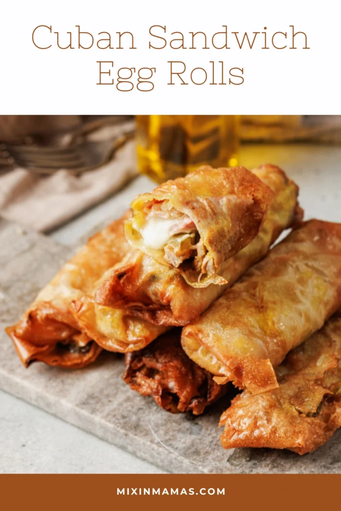 Pinterest graphic for Cuban sandwich egg rolls featuring crispy fried egg rolls stacked on a serving board