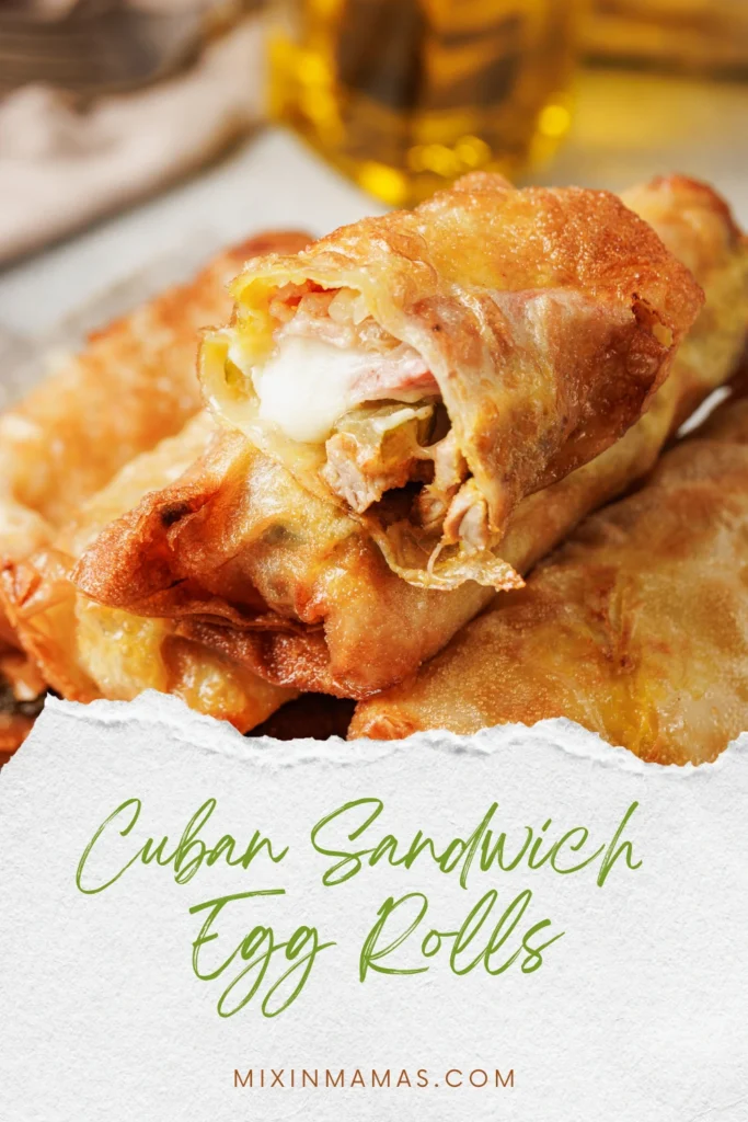 Pinterest image showing close up of Cuban sandwich egg rolls with melted cheese filling