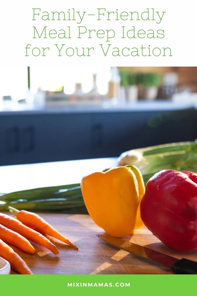 Pinterest graphic with fresh vegetables on a cutting board and the text family-friendly meal prep ideas for your vacation.