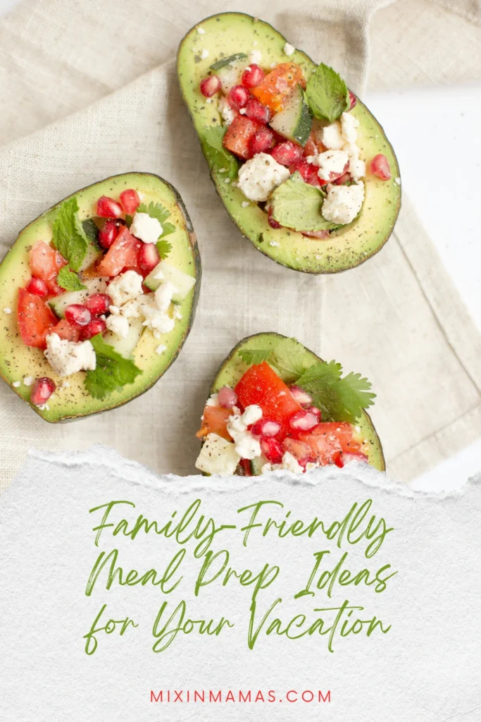 Pinterest pin showing stuffed avocados with pomegranate seeds and the text family-friendly meal prep ideas for your vacation.