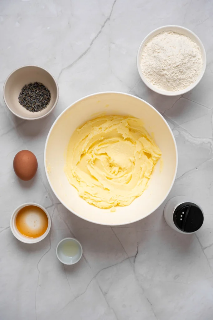 Butter and sugar creamed together in a mixing bowl for lavender cookie dough.