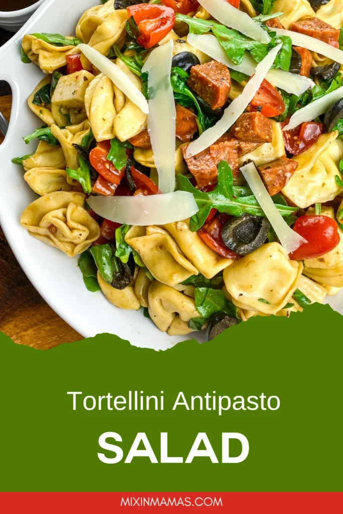 Pinterest pin design for Tortellini Antipasto Salad featuring a close-up of tortellini, olives, tomatoes, pepperoni, and Parmesan cheese.