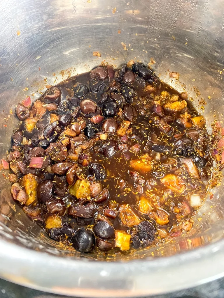 Cornstarch slurry being added to thicken the Instant Pot cherry chutney.