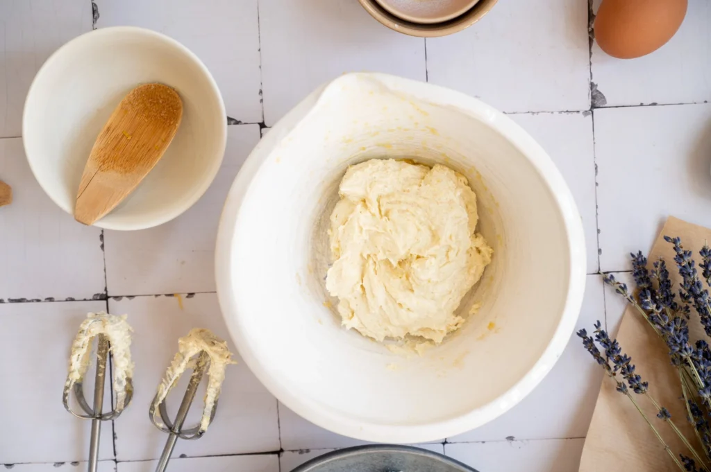 Creamed butter, olive oil, lemon zest, and sugar mixture for lemon lavender pound cake.