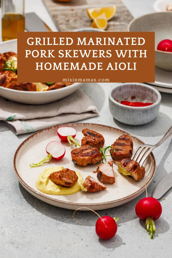 Grilled marinated pork pieces served with homemade aioli, radishes, and fresh herbs.