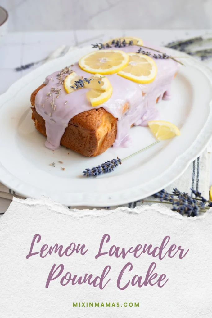 Glazed lemon lavender pound cake garnished with lemon slices and lavender above text reading “Lemon Lavender Pound Cake.”